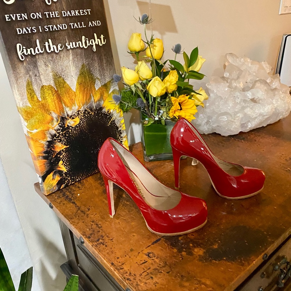 Pour la Victoire Irina red patent leather platform heels.